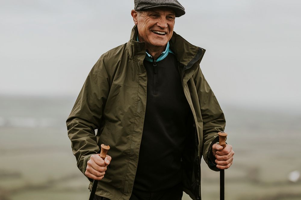 Senior man hiking mountain, countryside, outdoor travel