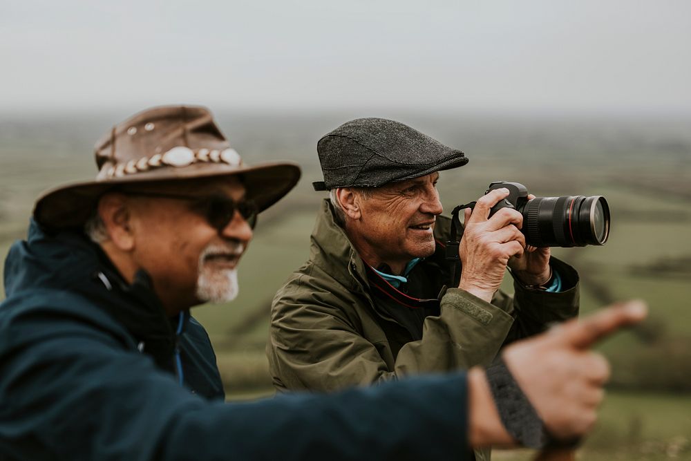 Senior nature photographers on mountain