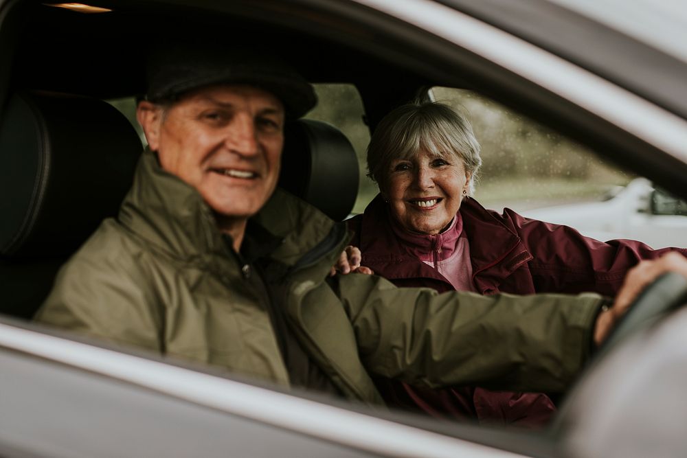 Senior couple sitting in car