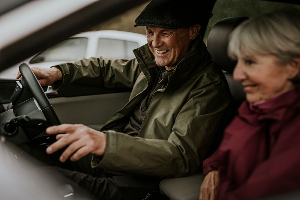 Senior couple sitting in car