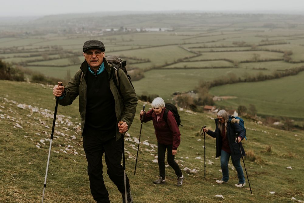 Senior hikers walking, nature travel photo