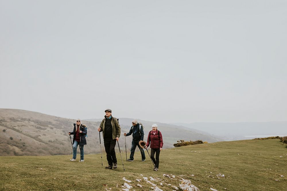 Senior hikers walking, nature travel photo