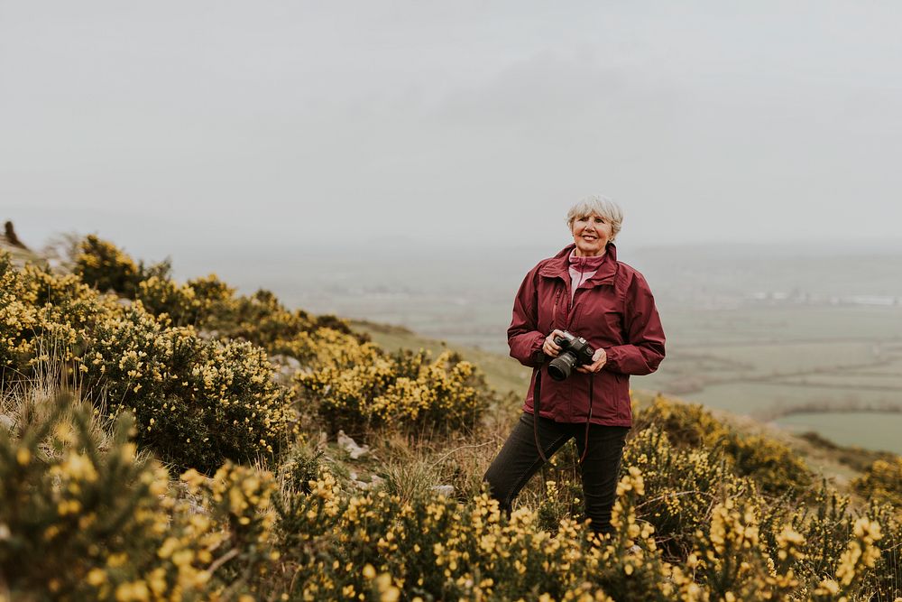 Senior woman photographer, outdoor travel