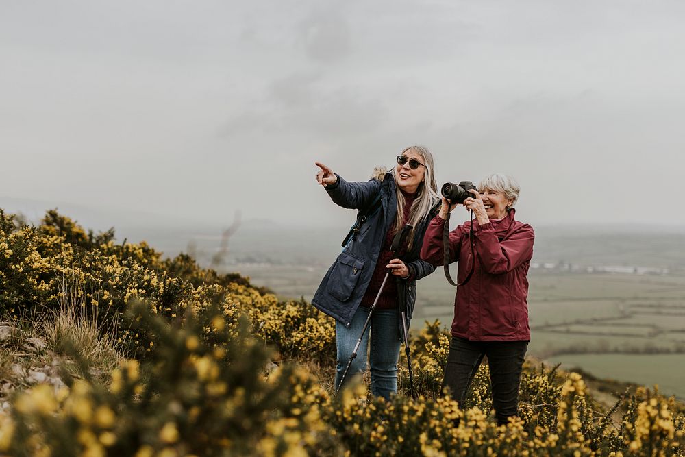 Senior women taking picture, outdoor travel