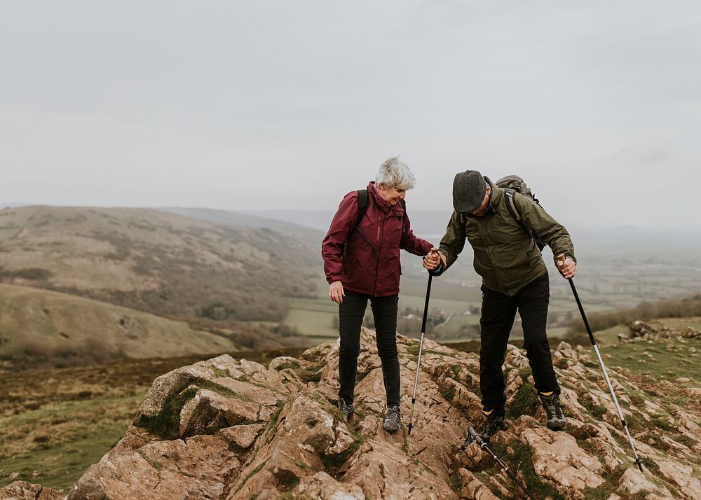 Senior couple hiking on mountain
