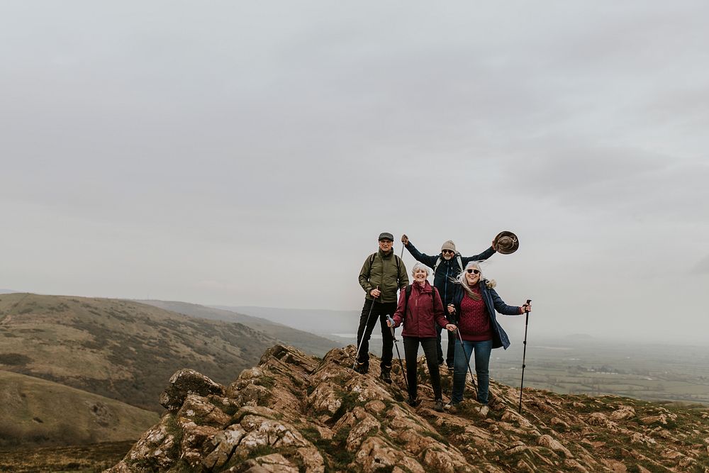 Happy senior hikers on mountain top