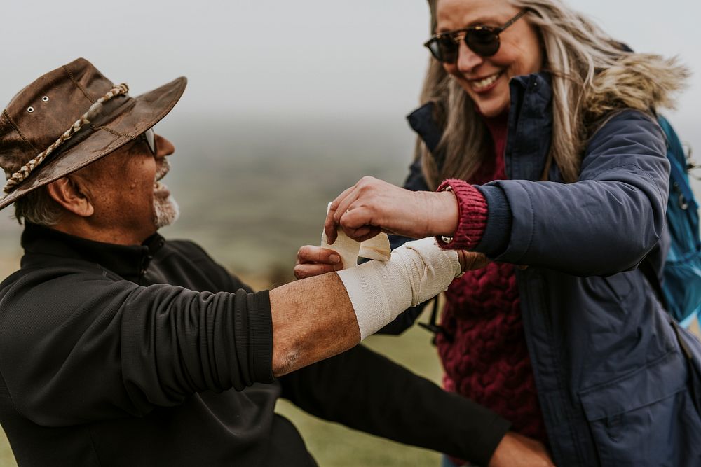 Woman wrapping elastic bandage, first aid