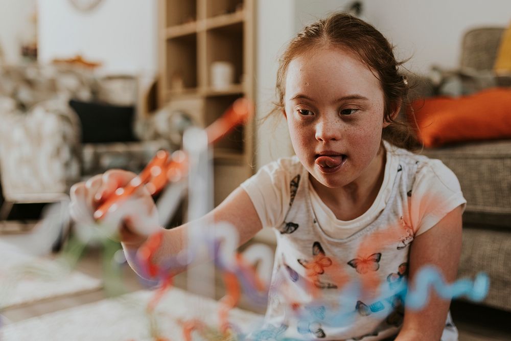 Girl with Down Syndrome playing buzz wire game