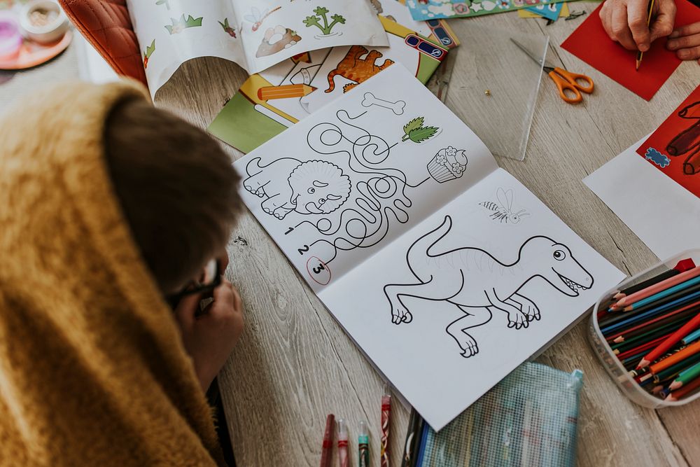 Little boy and coloring book, education photo