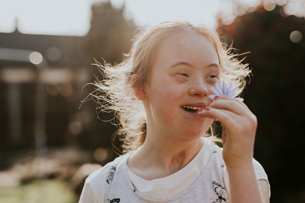 Happy girl with Down Syndrome, Spring portrait