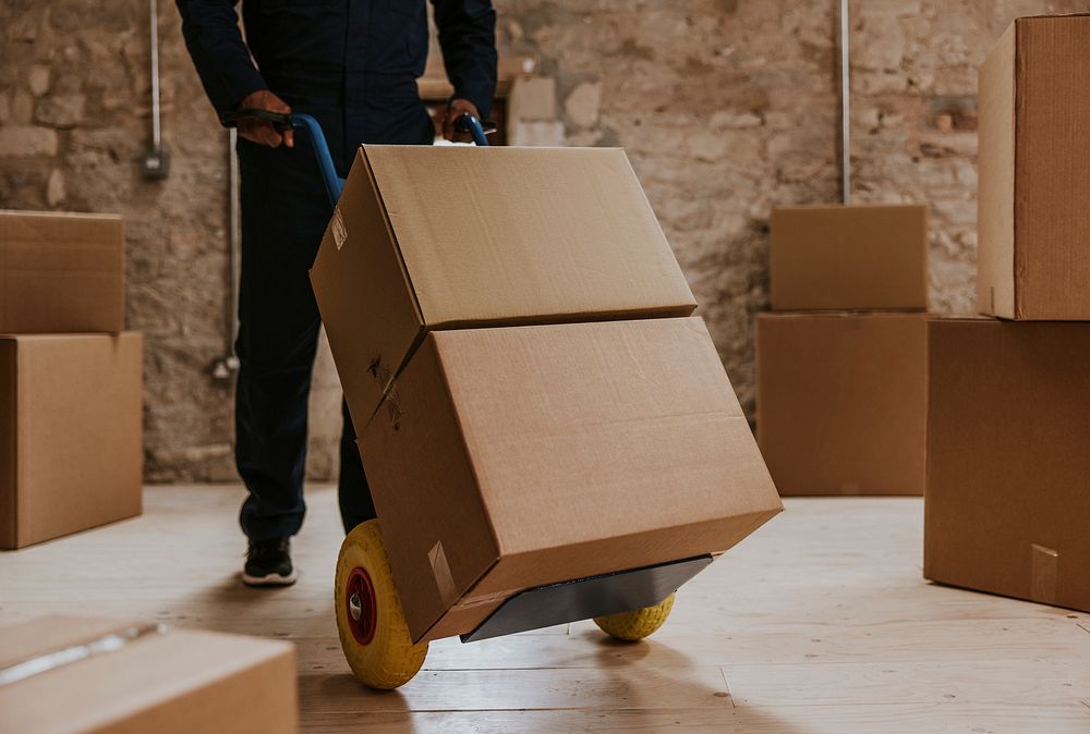 Moving worker unloading boxes new | Premium Photo - rawpixel