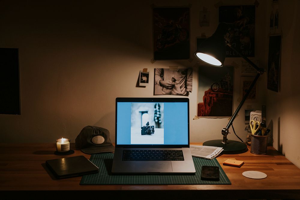 Photographer workstation aesthetic, laptop, wooden table