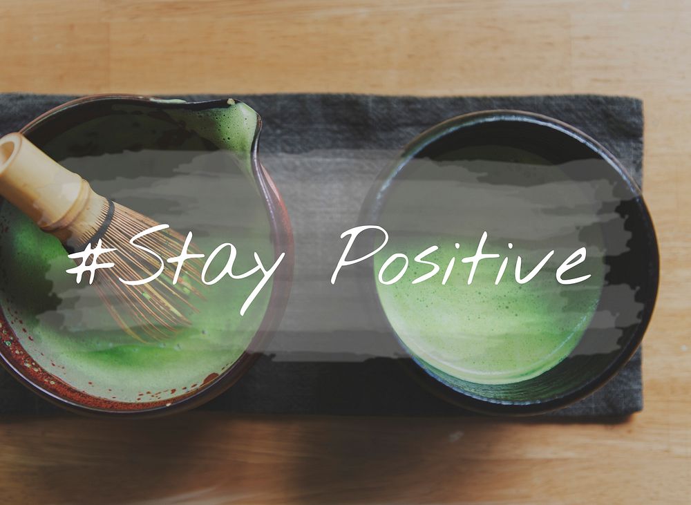 Hands with Japanese Green Tea and Stay Positive Word