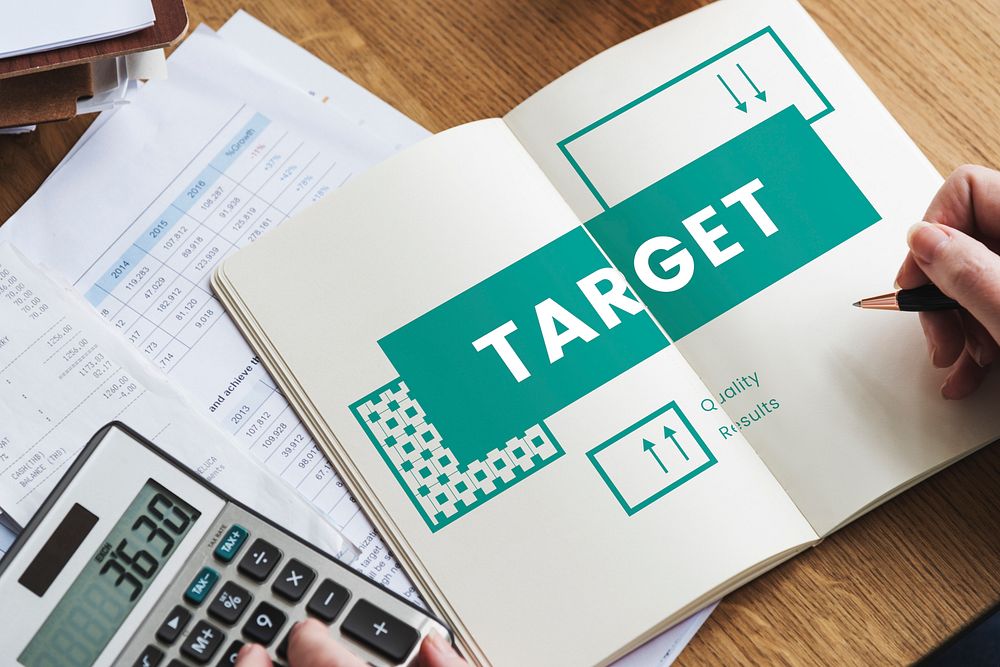 Business goals target process on notebook