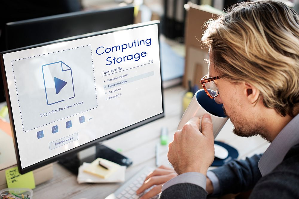 Man sharing uploading a file to cloud storage