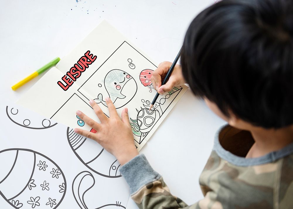 Young boy working on drawing pad network graphic overlay