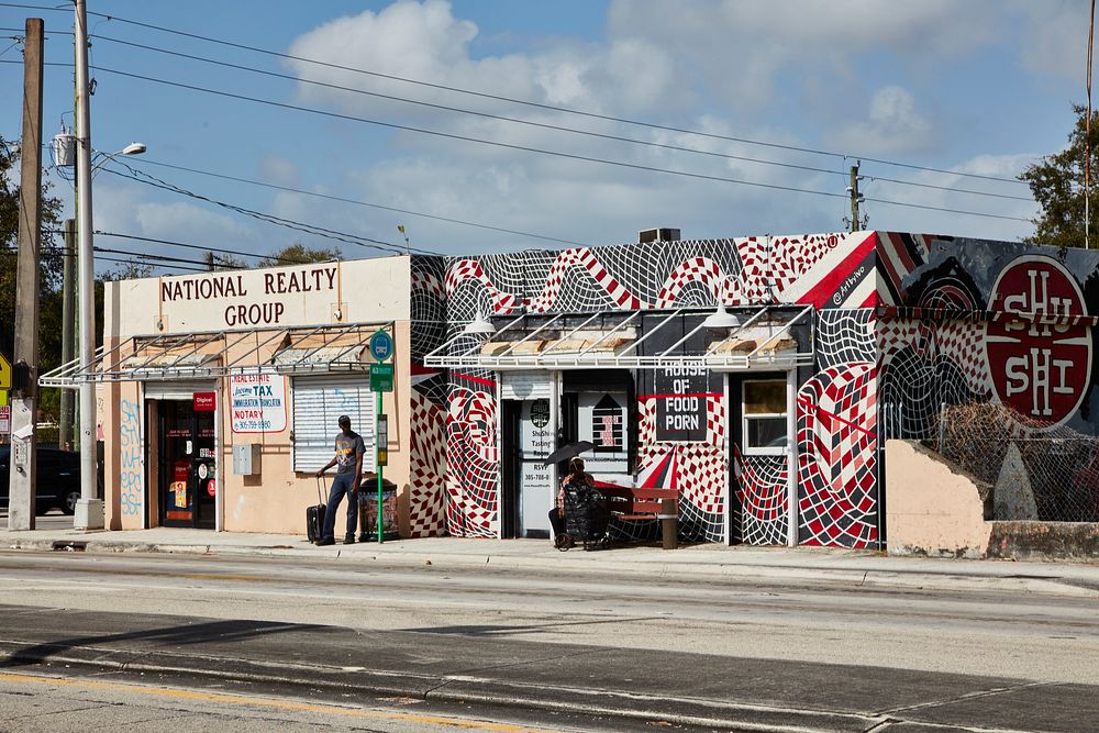                         Buildings in Miami, Florida's Little Haiti, including a restaurant with "porn" in its name that…