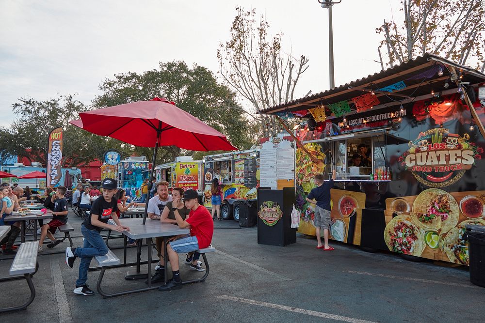                         One of dozens of international-cuisine food trucks (and crowded park benches on which to eat the…