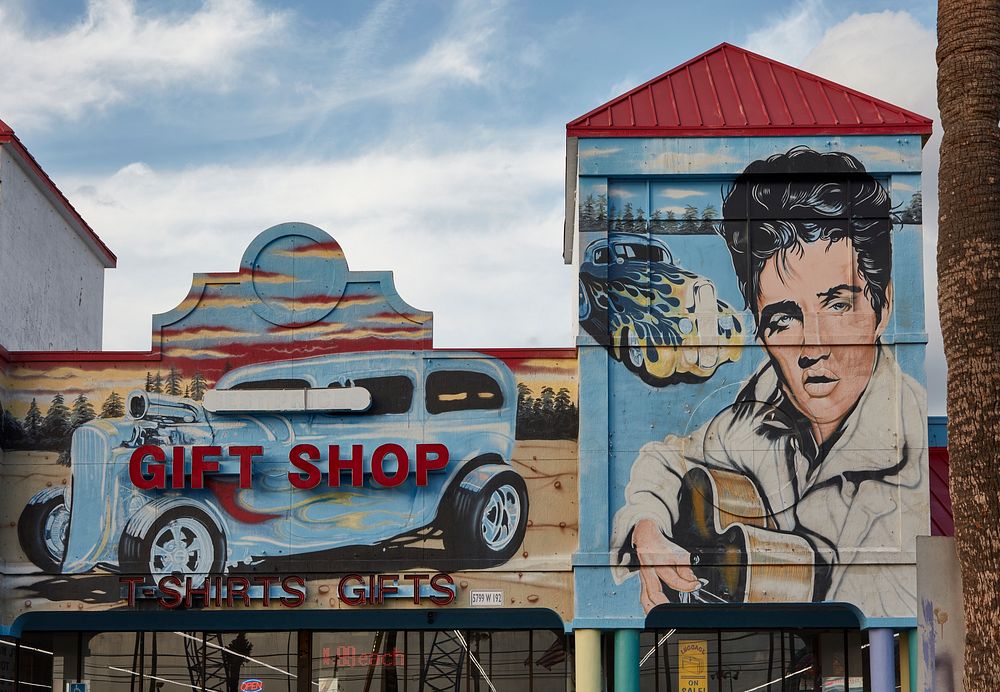                         Flamboyant gift-shop facade featuring singer Elvis Presley "still a legend" along a strip of such…