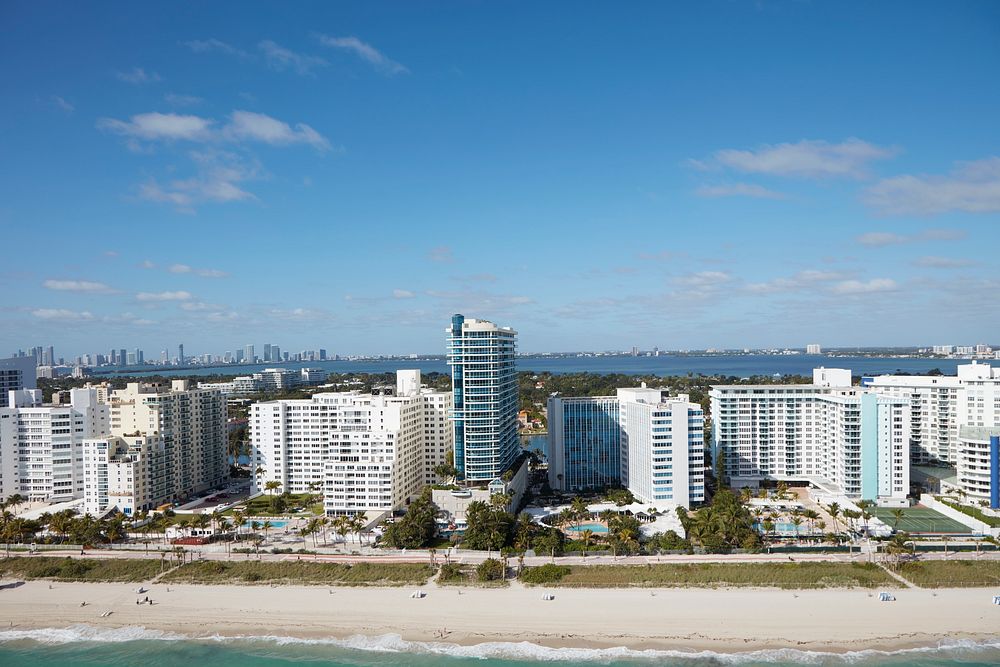                         Aerial view of Miami Beach, a bony-finger-like barrier island separated by Biscayne Bay from Miami…