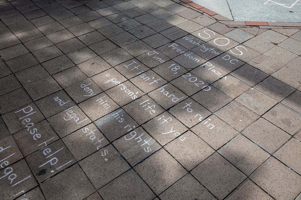                         Writing on the sidewalk on Pennsylvania Avenue at the 2020 Juneteenth Celebration, a few days after…
