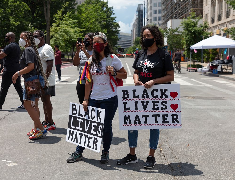                         Dancers and marchers visit the 2020 Juneteenth Celebration on Black Lives Matter Plaza in front of…