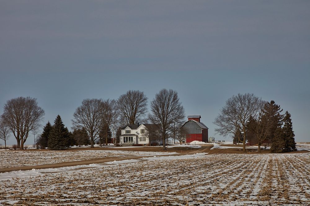                         Snowy field and farmstead outside DeKalb, Illinois                        