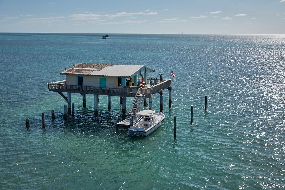                         A house on pilings in Stiltsville, a kind of outlaw watery town off Key Biscayne, a barrier island…