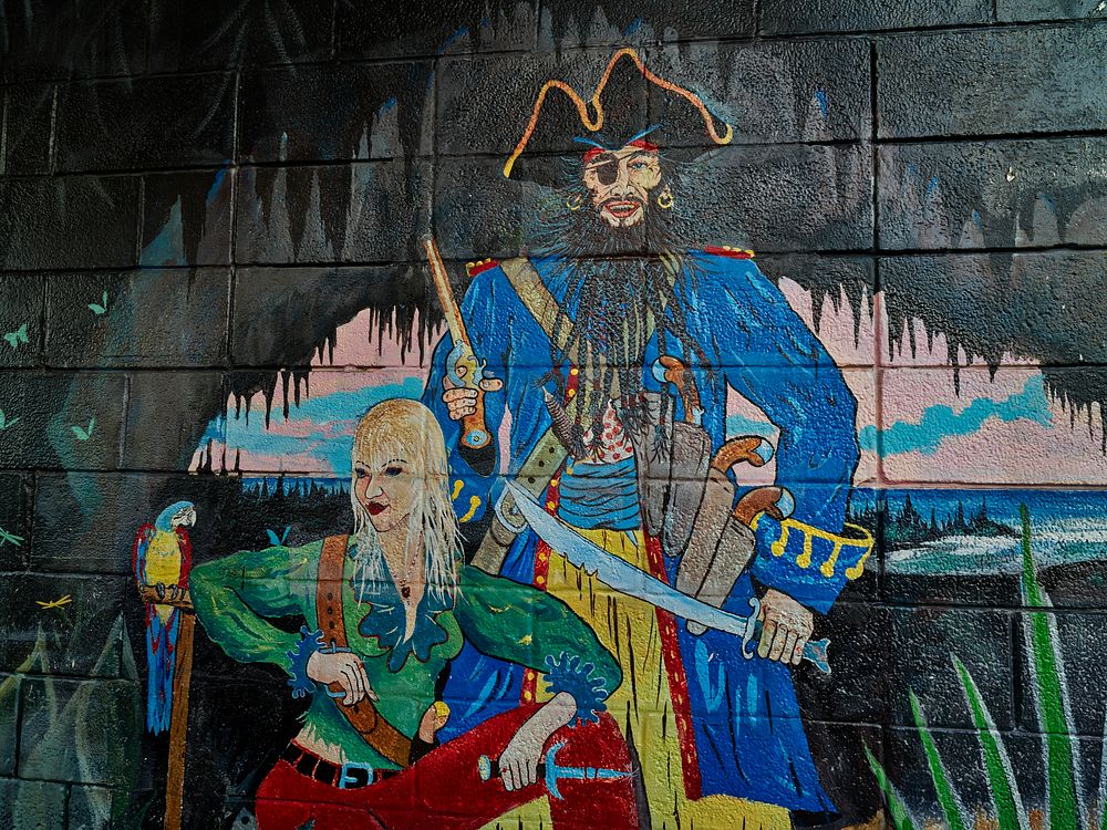                         Evocative pirate-themed mural on a wall of the Five Points Drive-Thru Liquors store in the town of…