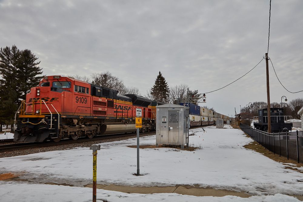                         Freight engines and their shipping-container freight cars pass the train depot in Rochelle, Illinois…