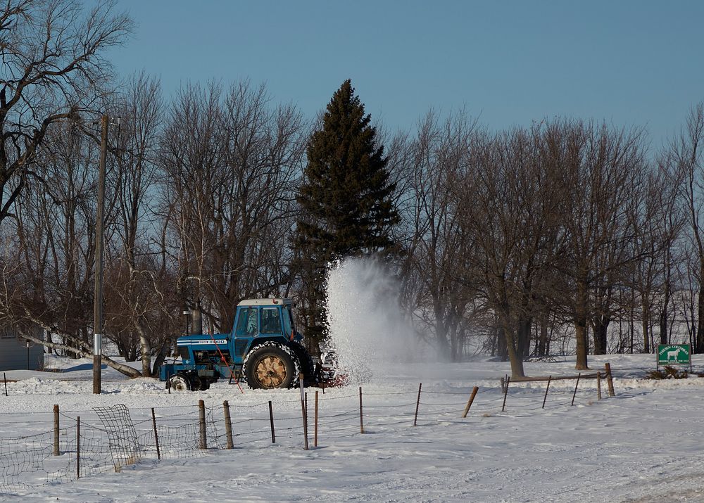                         It takes not only a snowblower but also a tractor to keep this country lane clear near Windom…