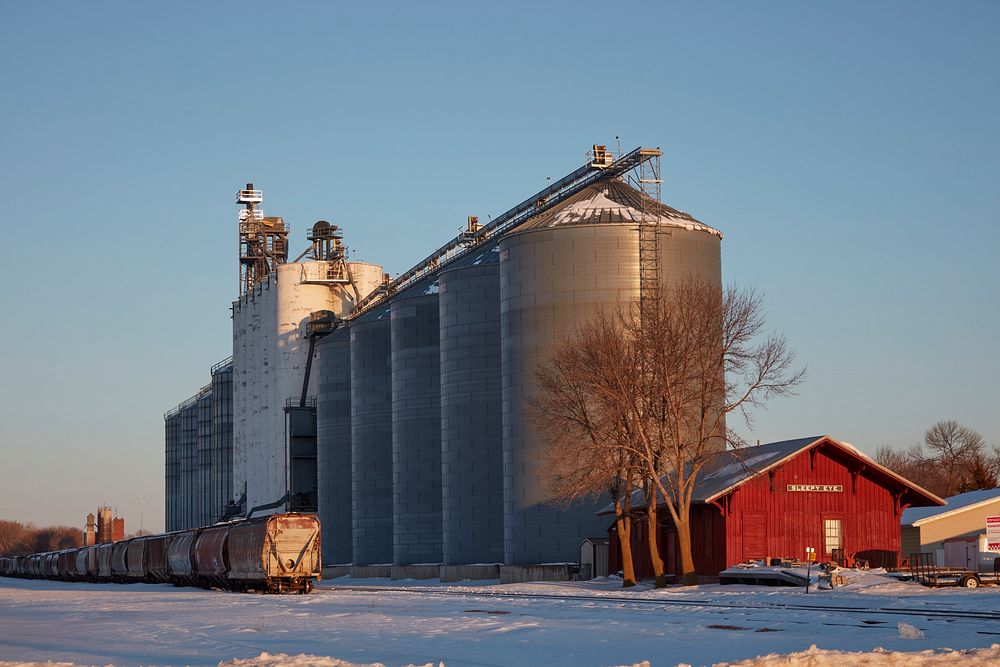                         Grain silos and small railroad station in Sleepy Eye, Minnesota. The town got its name from a nearby…