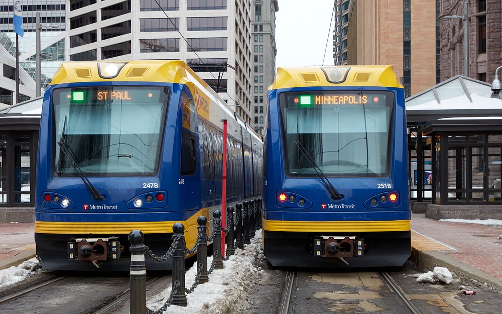                         Metro Transit light-rail trains pass each other in downtown Minneapolis, which--along with…