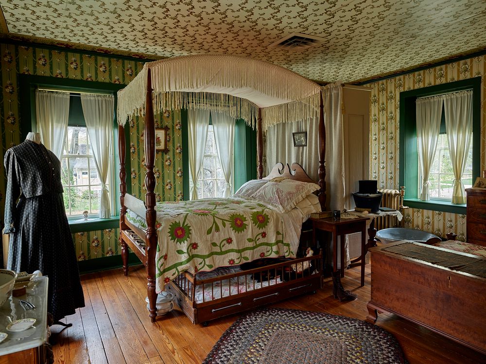                         An elegant bedroom inside the Riley County Historical Museum's Wolf House historical museum in…