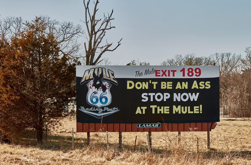                         This cheeky billboard advertising the old Mule Trading Post, a former stop for souvenirs along a…