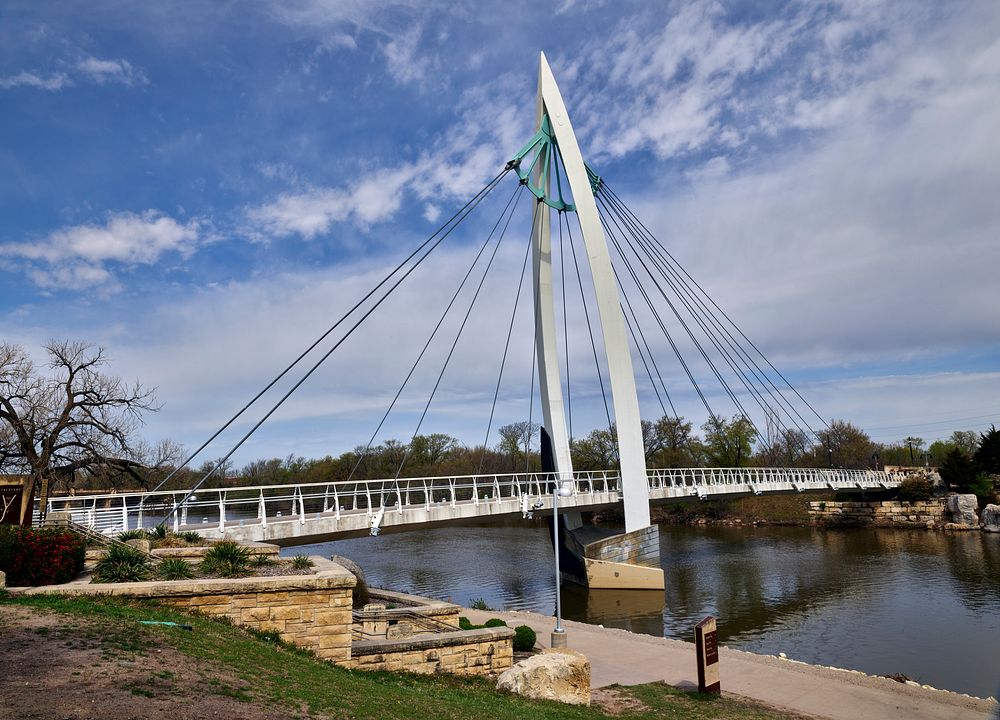                         One of two cable-stayed pedestrian and bicycle bridges over the Arkansas River, part of a riverfront…