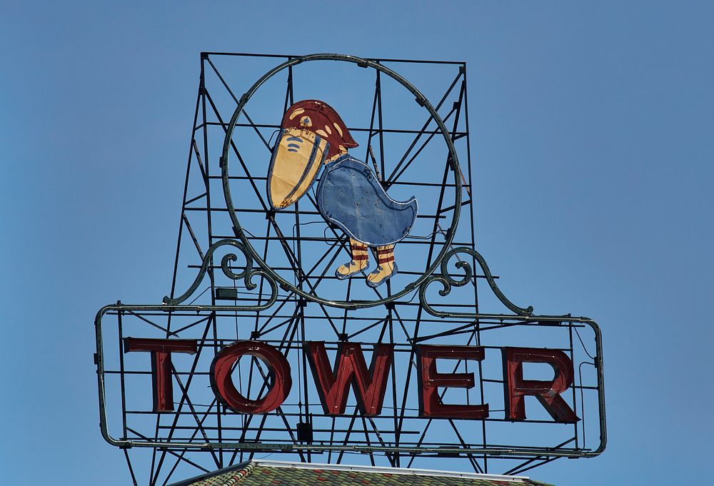                         One of two similar neon signs above Jayhawk Tower Business Center in downtown Topeka, the capital…