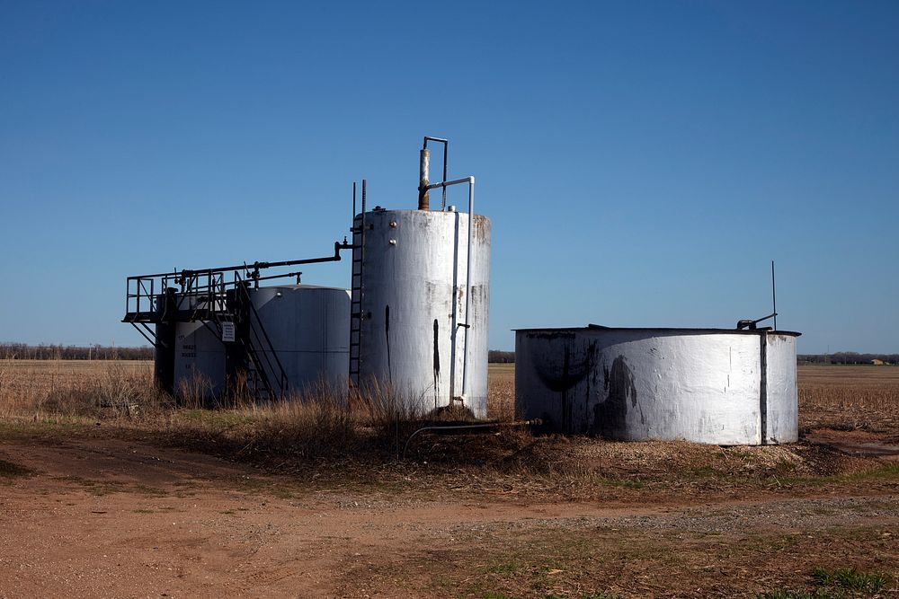                         Small oil storage tanks in a field near Lindsborg in Saline County, Kansas                        
