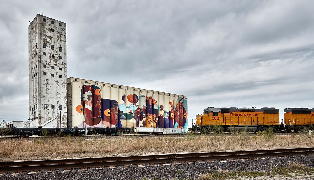                         A freight train approaches the artwork on the northside Wichita, Kansas, Beachner Co. grain elevator…