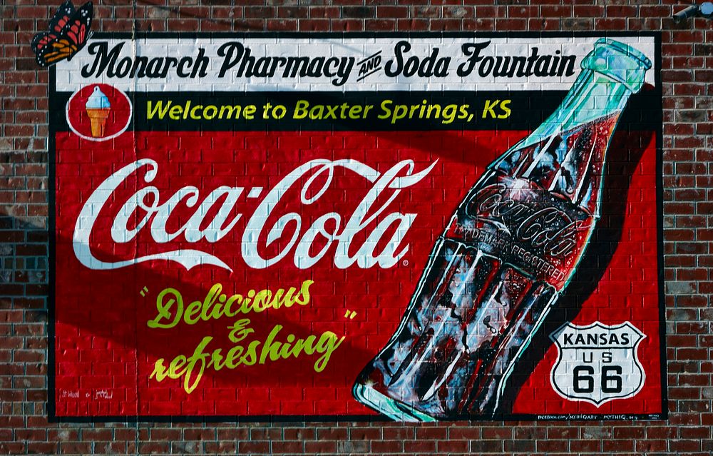                         A combination welcome and vintage Coca-Cola sign in Baxter Springs, one of only two small towns…