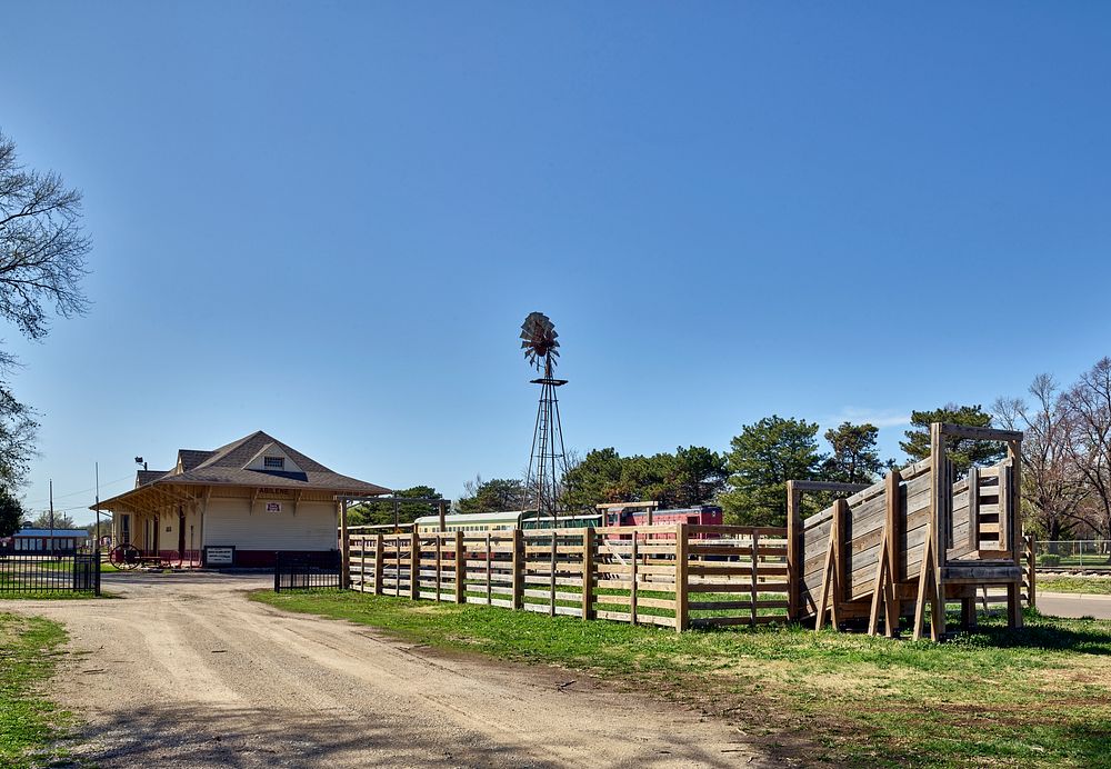                         A windmill and old train depot at nonprofit Historic Abilene Inc.'s Old Abilene Town, a museum…