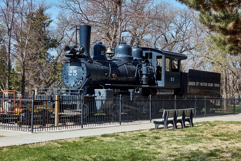                         An old Garden City Western Railway steam locomotive and coal tender are displayed in a park in…