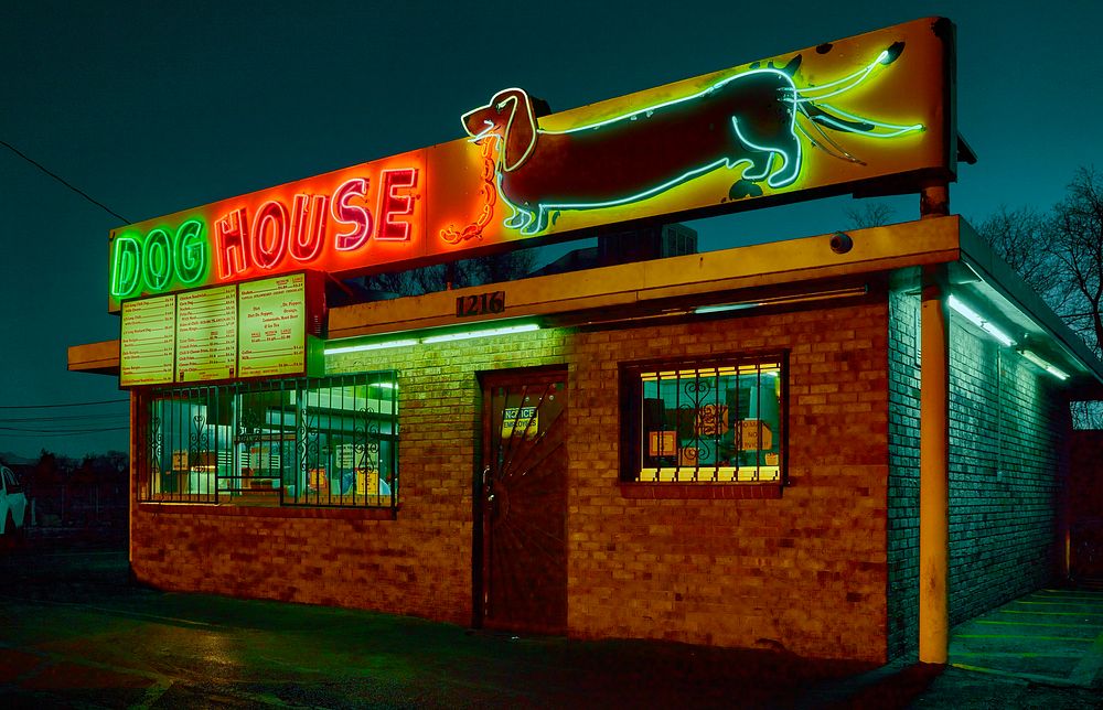                         Both the old Dog House Drive In restaurant and its clever neon sign, whose wiener dog's, or…