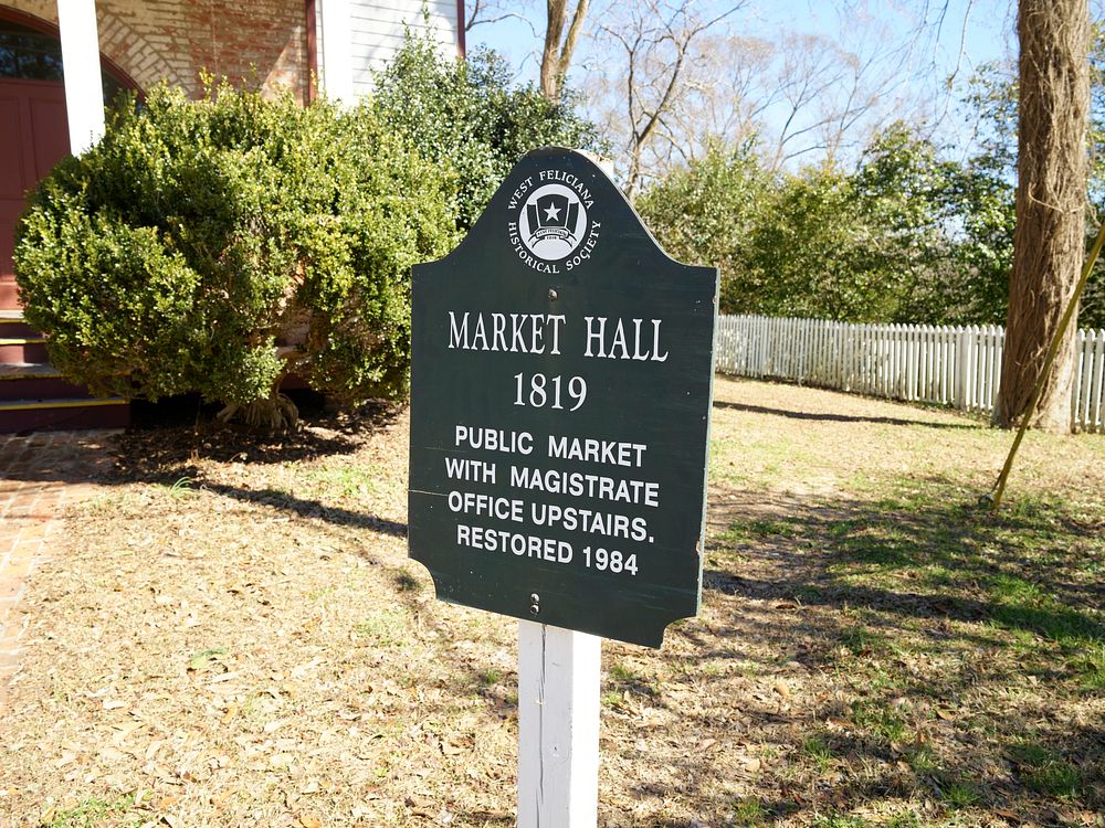                         Sign for Market Hall, built in 1819 in St. Francisville, Louisiana, once had not only magistrate's…