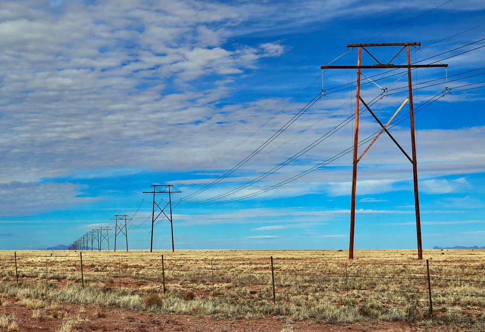                         A "forever" line of power poles near Hillsboro in Sierra County, New Mexico                        