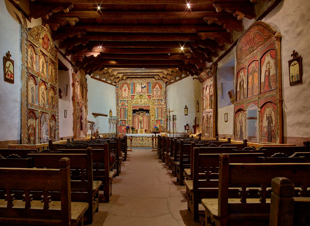                        The sanctuary, filled with hand-painted reredos (altar screens) and other intricate decorations at…