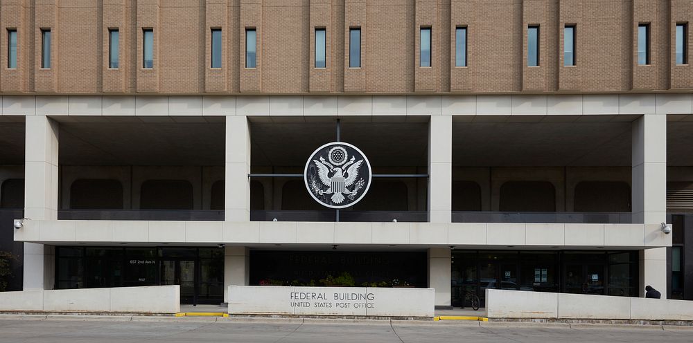                         Front exterior of the Federal Building and U.S. Post Office, located in a low-rise modern building…