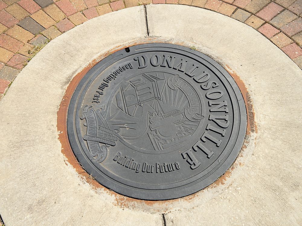                         A manhole cover in the 50-block historic district of Donaldsonville, a colorful small town that is…