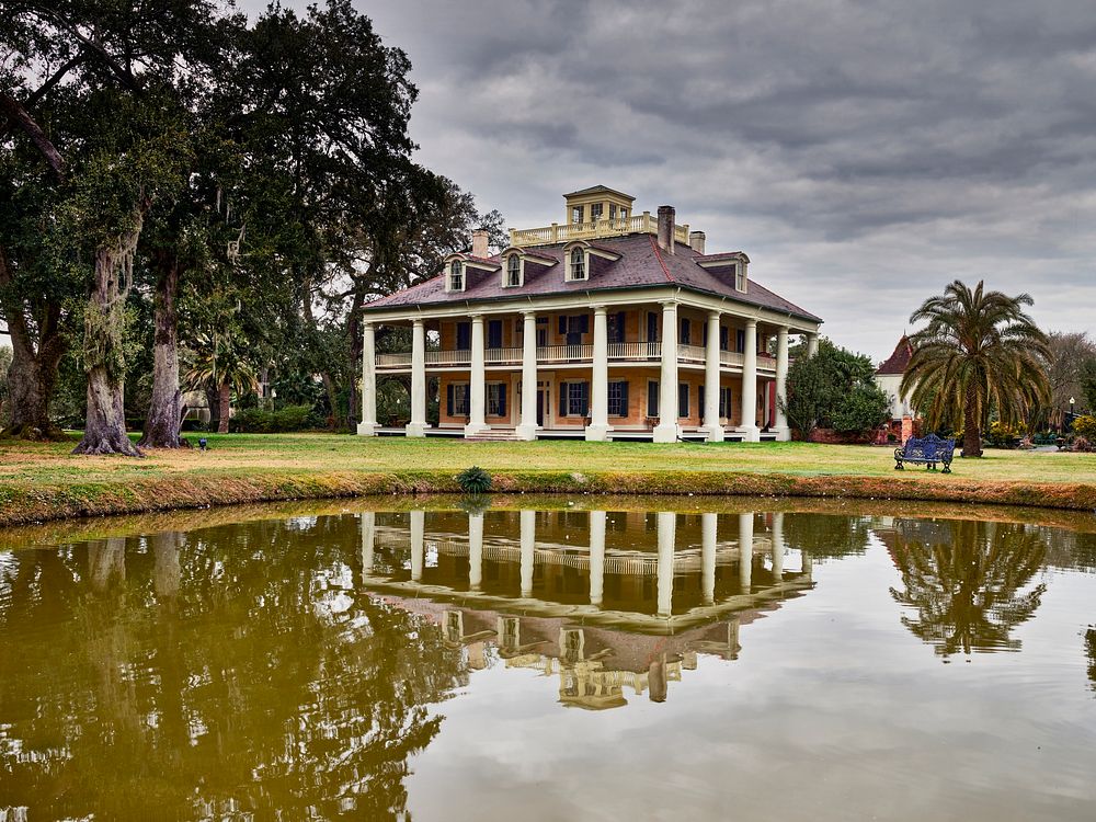                         The plantation mansion reflects in a pond at Houmas House and Gardens, a Louisiana attraction that…