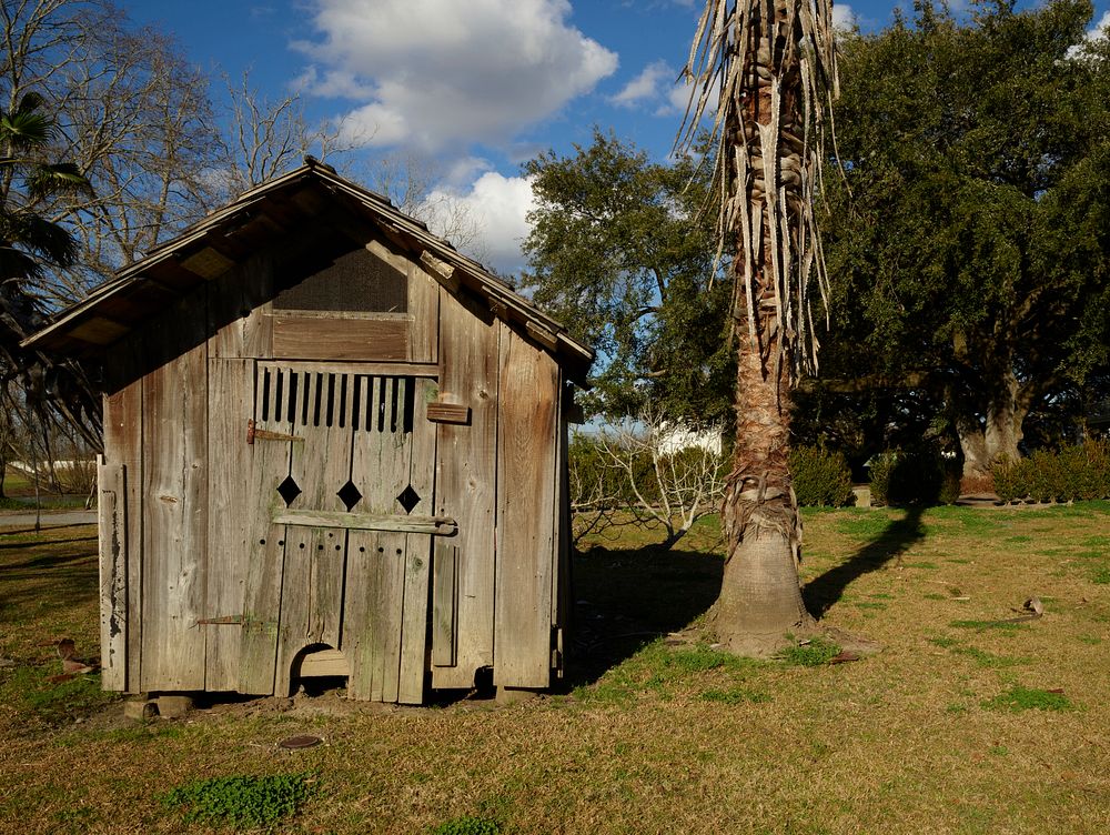                         A significant outbuilding preserved at Whitney Plantation, one of several surviving antebellum…